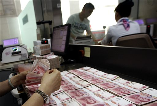 Traders work on the floor of the New York Stock Exchange Thursday Aug. 13 2015. Global stocks are steadying as the decline in China's currency slowed and the country's central bank tried to ease fears of more big declines