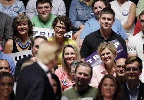 Supporters listened as Republican presidential candidate Donald Trump spoke at a rally in Oskaloosa Iowa