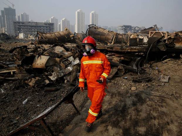 Firefighter rescued from blast zone in China's Tianjin port as death toll