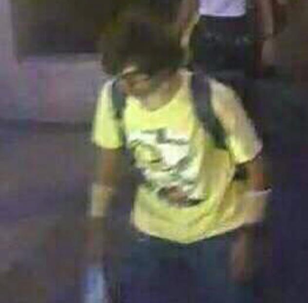 This image released by the Royal Thai Police shows a man near the Erawan shrine before an explosion occurred in Bangkok Authorities said he had been cleared