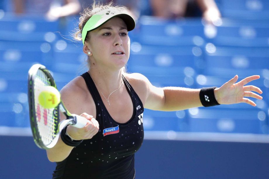 Belinda Bencic of Switzerland returns the ball to Lucie Safarova of the Czech Republic during a match at the Western & Southern Open tennis tournament