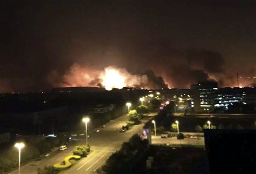 News Agency smoke and fire erupt into the night sky after an explosion in the Binhai New Area in north China's Tianjin Municipality on Thursday Aug. 13 2015. Chinese state media reported huge explosions at the Tianji