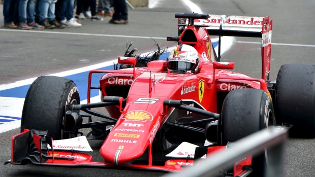 Blowout Sebastian Vettel returns to pit lane during the Belgian Grand Prix