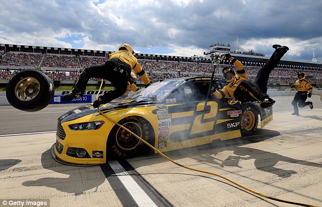 Brad Keselowski and his #2 car hit both a tire carrier and a jackman during Sunday's Windows 10 400 event at Pocono Raceway in Pennsylvania