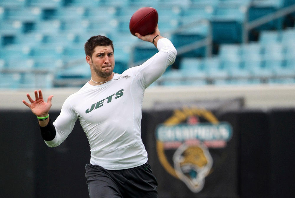 Now former New York Jets backup quarterback Tim Tebow warms up before the start of their NFL football game against the Jacksonville Jaguars in Jacksonville Florida