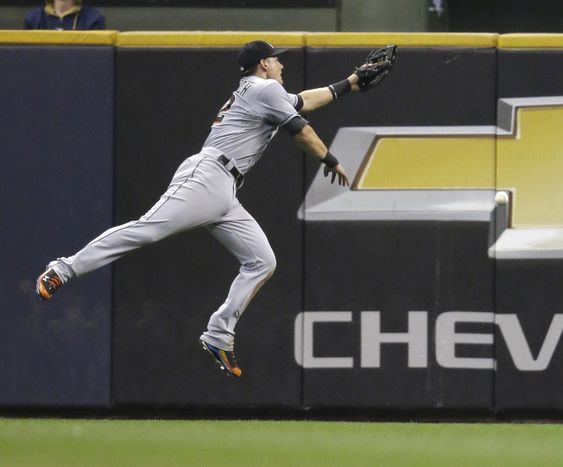 Dietrich can't catch a double by Milwaukee Brewers Jason Rogers during the fourth inning of a baseball game Tuesday Aug. 18 2015 in Milwaukee