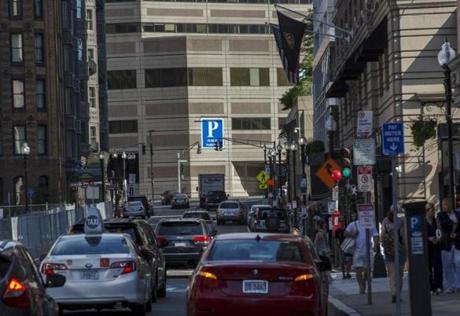 Traffic filled Exeter Street in the Back Bay in June