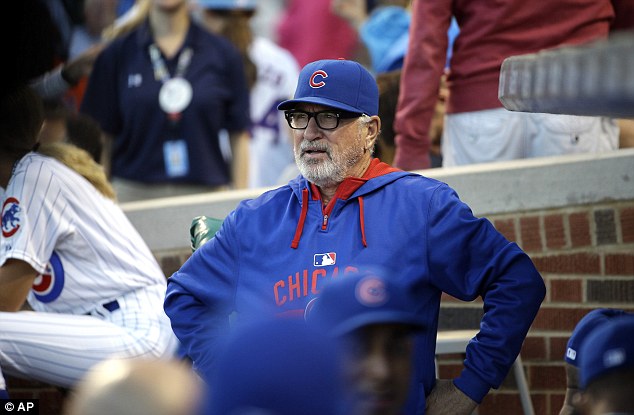 Chicago Cubs manager Joe Maddon looks to the field before a baseball game against the Atlanta Braves on August 20 in Chicago. After a woman was hit by a foul ball during a game between the Cubs and Braves he has warned fans to pay attention