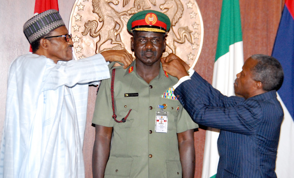 Buratai middle being decorated by President Buhari left and VP Osinbajo recently