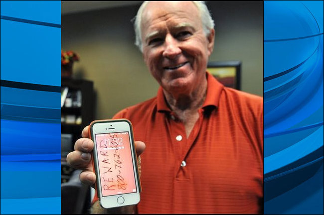 Ben Wilson proudly shows-off his iPhone that survived a 9,300 foot drop from an airplane and landed in a pasture near Joplin Texas. Wilson said he was able to find his phone using an application that draws a map pointing to the missing device. (Chris Wal