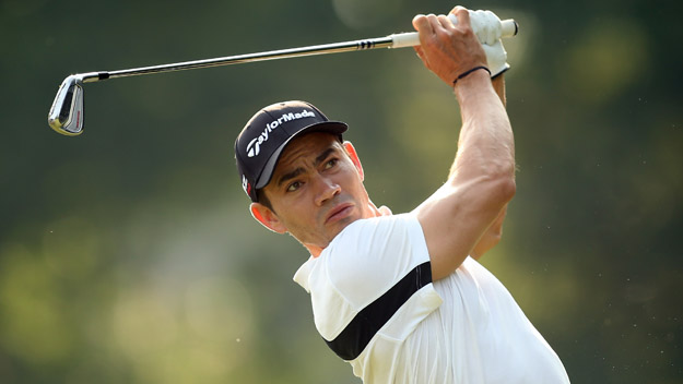 Camilo Villegas of Colombia plays his tee shot on the third hole during the second round of the Wyndham Championship