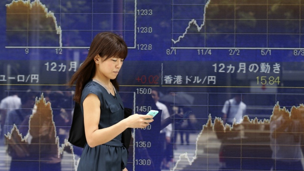 Screens display financial information on the floor at the New York Stock Exchange in New York