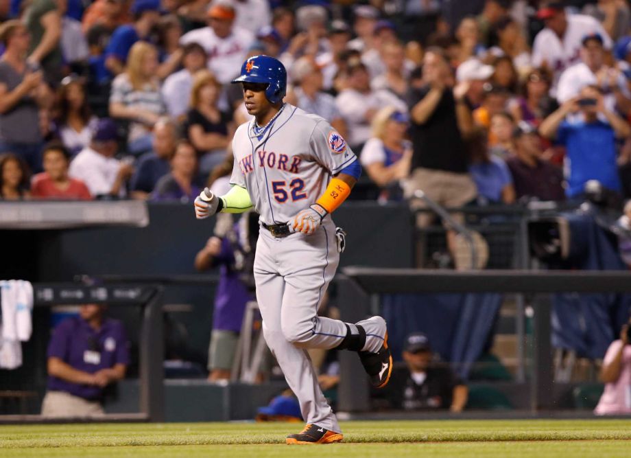 Fans stand and cheer as New York Mets Yoenis Cespedes front circles the bases after hitting a solo home run off Colorado Rockies relief pitcher Christian Bergman to lead off the top of the fourth inning of a baseball game