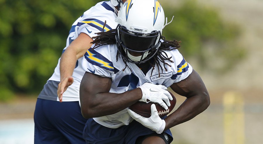 Chargers Melvin Gordon gets a handoff from Chase Rettig during practice