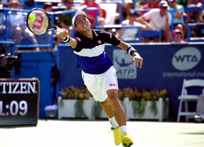 Kei Nishikori of Japan returns the ball against Marin Cilic of Croatia at the Citi Open tennis tournament Saturday Aug. 8 2015 in Washington