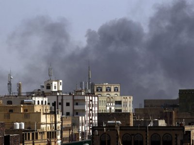 Yemeni children stand amid the rubble of buildings targeted in a Saudi airstrike on the capital Sana’a