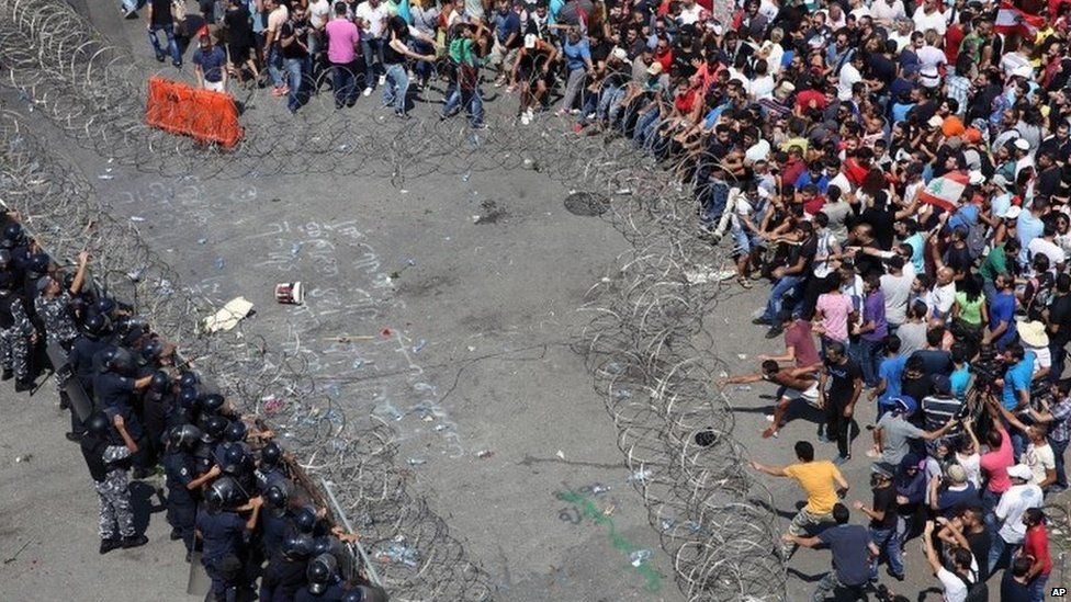 Lebanese activists right clash with policemen left in downtown Beirut