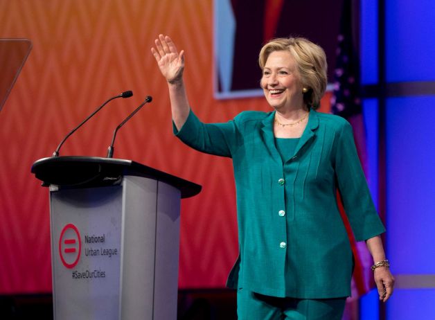 Democratic presidential candidate Hillary Rodham Clinton waves as she is introduced before speaking to the National Urban League Friday