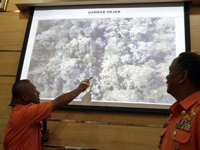 Rescue workers show area of suspected Trigana Air crash site