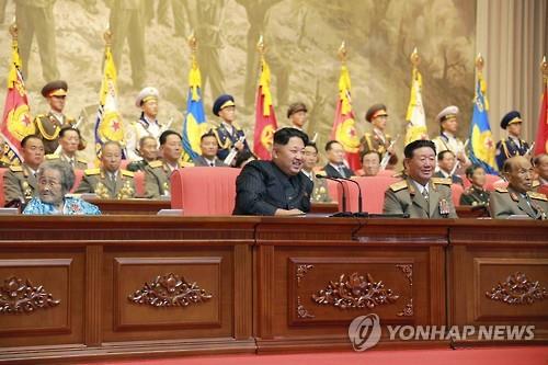 North's Rodong Sinmun newspaper shows North Korean leader Kim Jong-un delivering a congratulatory address during a national meeting of veterans in Pyongyang