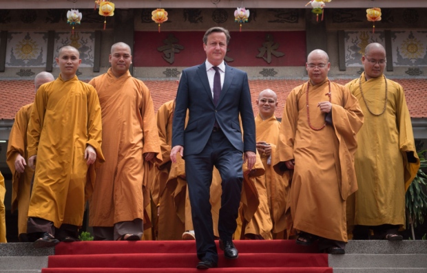 David Cameron visits Buddhist temple in Ho Chi Minh City becoming first Prime Minister to visit Vietnam before flying to Malaysia