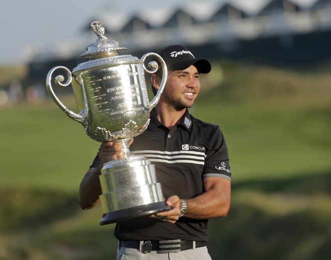 Jason Day of Australia holds up the Wanamaker Trophy after winning the PGA Championship golf tournament Sunday Aug. 16 2015 at Whistling Straits in Haven Wis