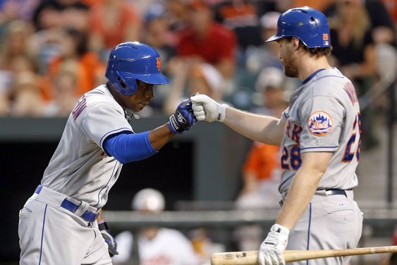 Curtis Granderson left greets teammate Daniel Murphy after hitting a solo home run in the first inning of a baseball game against the Baltimore Orioles Tuesday Aug. 18 2015 in Baltimore