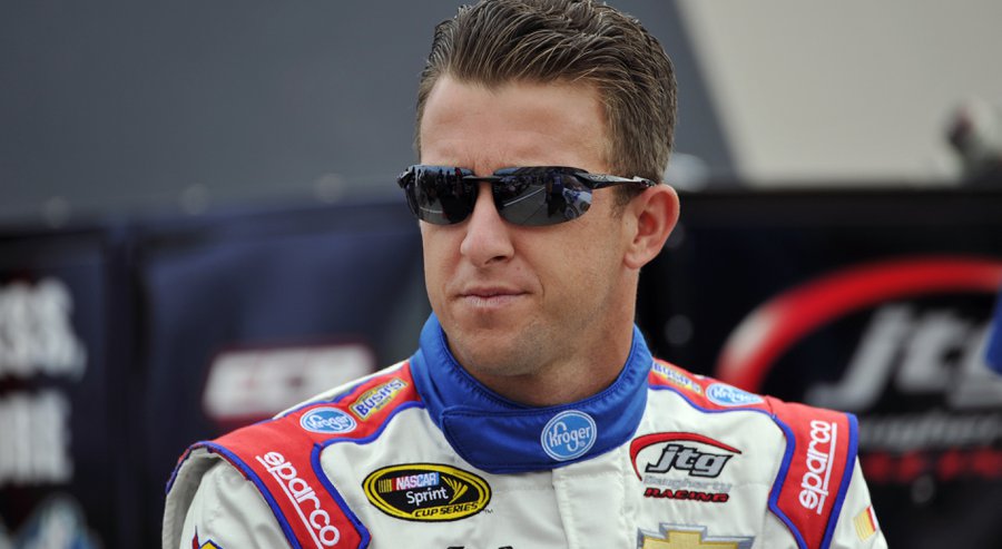 AJ Allmendinger waits by his car before qualifying for Sunday's NASCAR Sprint Cup series auto race at Watkins Glen International Saturday Aug. 8 2015 in Watkins Glen. N.Y