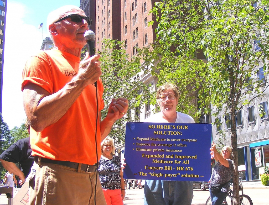 Ed Grystar emcee of the rally and chair of the Western PA Coalition for Single Payer Healthcare asks for not only a continuation of Medicare but an improvement