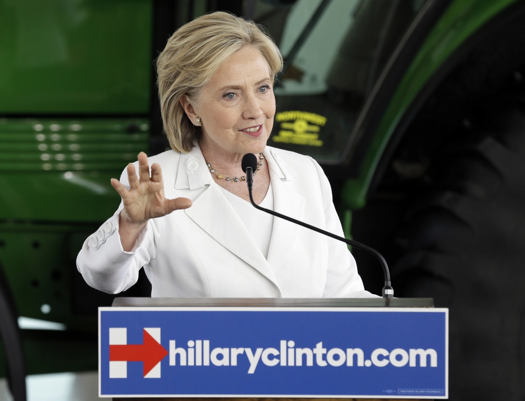 Democratic presidential candidate Hillary Clinton picks out fresh corn during a visit to Dimond Hill Farm in Hopkinton New Hampshire