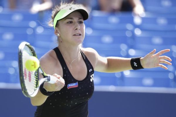 Belinda Bencic of Switzerland returns the ball