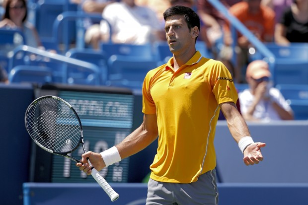 Novak Djokovic of Serbia reacts during a match against David Goffin of Belgium at the Western & Southern Open tennis tournament Thursday Aug. 20 2015 in Mason Ohio