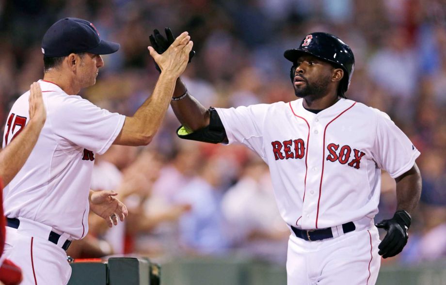 Boston Red Sox's Jackie Bradley Jr right is congratulated by Boston Red Sox interim manager Torey Lovullo after his threerun home run off Cleveland Indians starting pitcher Corey Kluber during the fourth inning of a baseball game at Fenway Park in Bos