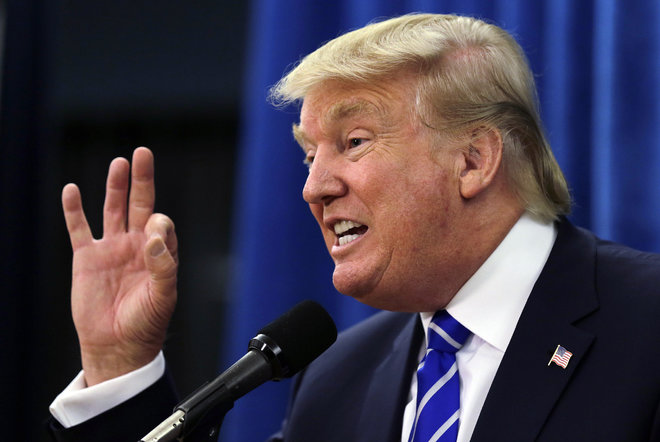 Republican presidential candidate Donald Trump gestures during a media availability prior to a campaign stop at Winnacunnet High School in Hampton N.H. Friday Aug. 14 2015