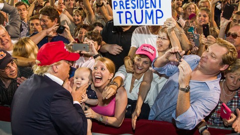 Donald Trump greets supporters after his rally in Alabama