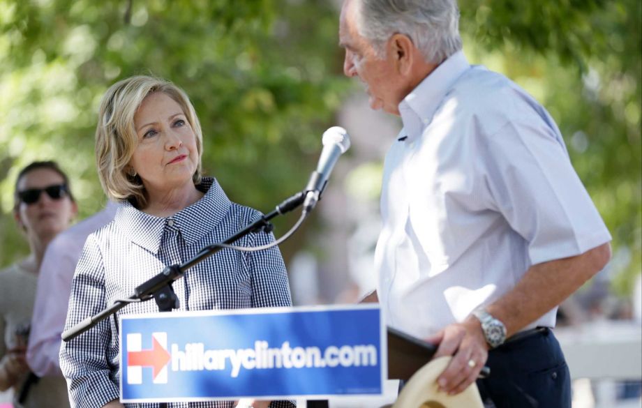 Democratic presidential candidate Hillary Rodham Clinton talks with former U.S. Sen. Tom Harkin right during a visit to the Iowa State Fair Saturday Aug. 15 2015 in Des Moines Iowa