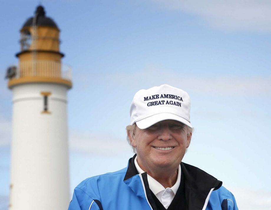Republican presidential candidate Donald Trump poses for the media during the third day of the Women's British Open golf championship on Trump's Turnberry golf course in Turnberry Scotland Trump sells himself