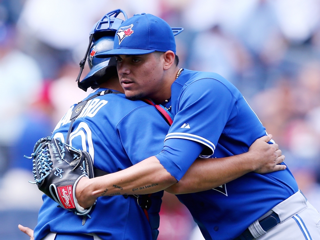 Catcher Dioner Navarro left and pitcher Roberto Osuna of the Toronto Blue Jays celebrate a win over the New York Yankees on Sunday at Yankee Stadium