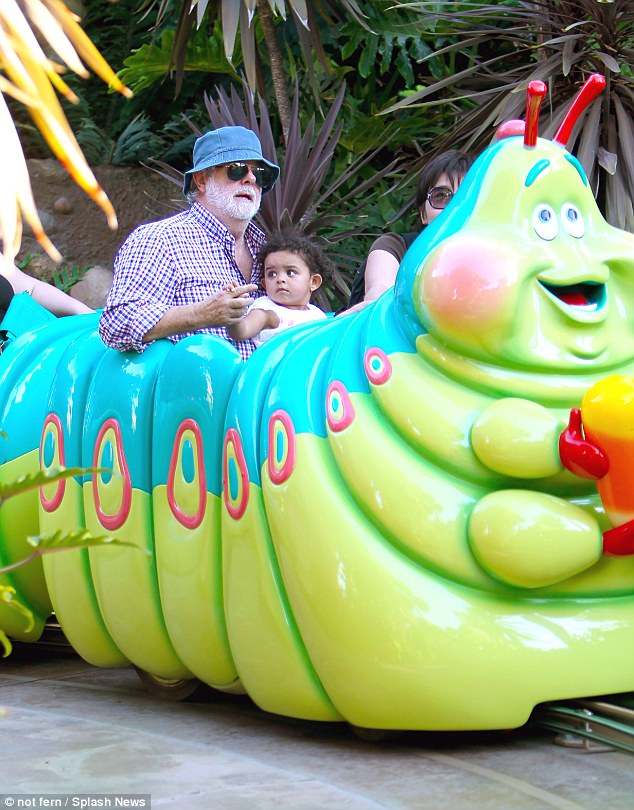 Doting dad George Lucas was seen in average dad clothes as he took his young daughter Everest to Disney California Adventure in Anaheim