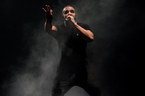 Canadian singer Drake performs on the main stage at Wireless festival in Finsbury Park London. A shooting started Tuesday Aug. 4 at a Toronto nightclub event hosted by rapper Drake and then spilled outside onto