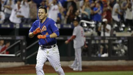 An emotional Wilmer Flores celebrates his game-winning home run