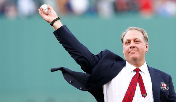 Former Boston Red Sox pitcher Curt Schilling #38 throws out the first pitch after being inducted into the Red Sox Hall of Fame prior to the game against the Minnesota Twins during the game