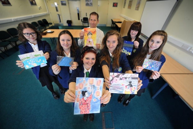 Mark Sidley with the students and their art work