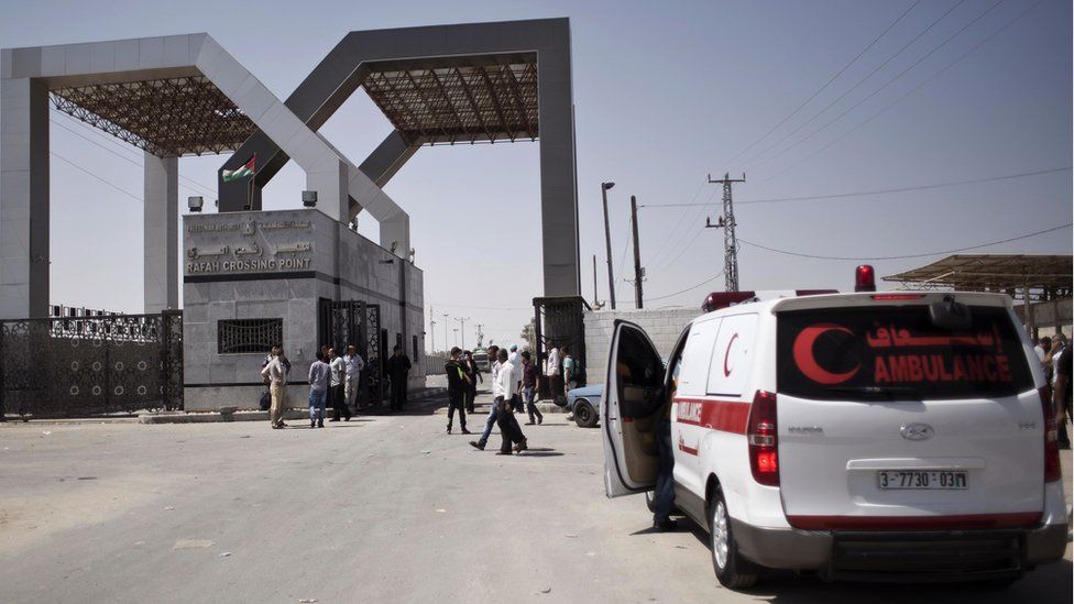 A Palestinian ambulance waits to cross into Egypt at the Rafah border crossing in the southern Gaza Strip on 20 August 2015