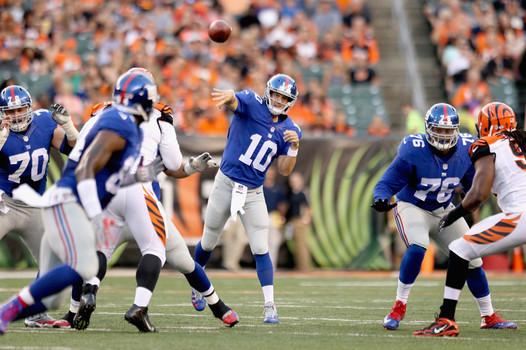 CINCINNATI OH- AUGUST 14 Eli Manning #10 of the New York Giants throws a pass against the Cincinnati Bengals during an preseason game at Paul Brown Stadium