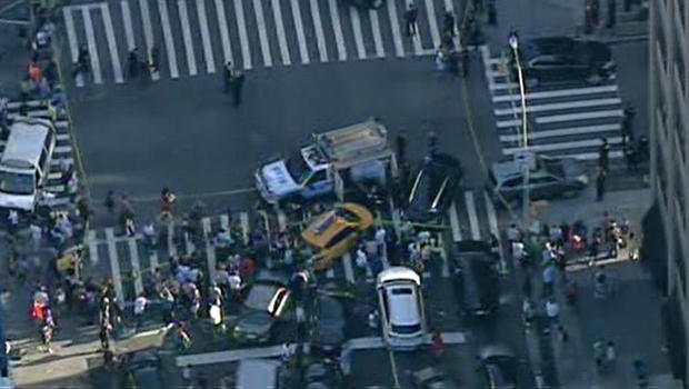 Emergency crews block an intersection in lower Manhattan after a shooting