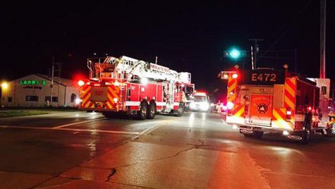 Emergency responders helping at the accident scene where a train struck a car