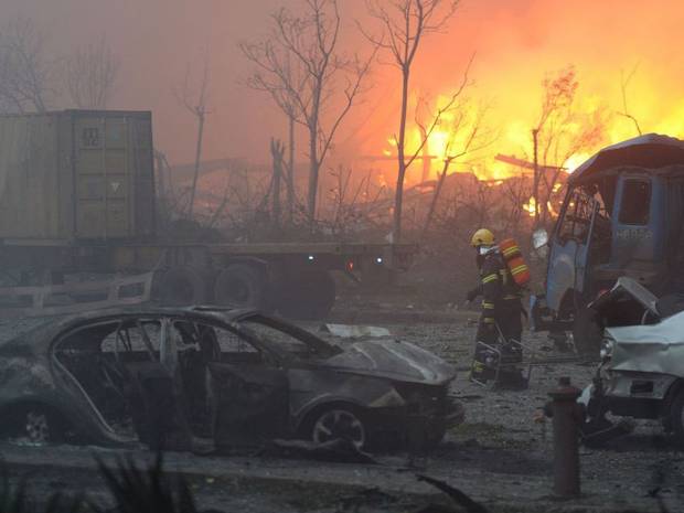 Firefighter rescued from blast zone in China's Tianjin port