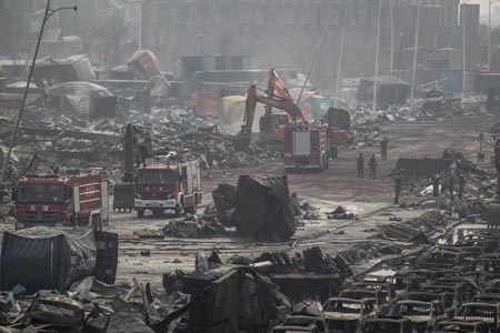 Firefighters and rescue workers at the site where deadly explosions rocked Tianjin last week Aug. 17