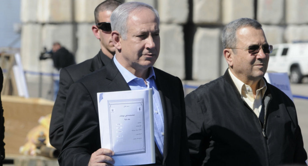 Prime Minister Mr Benjamin Netanyahu and Defense Minister Mr Ehud Barak hold an Iranian instruction manual for the C704 antiship missile